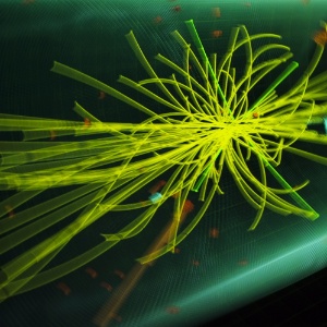 Imagem mostra uma colisão de partículas exibida pelo Cern, laboratório da Organização Europeia para a Pesquisa Nuclear e trata-se de um vento típico de um candidato a bóson de Higgs, a "partícula de Deus" 